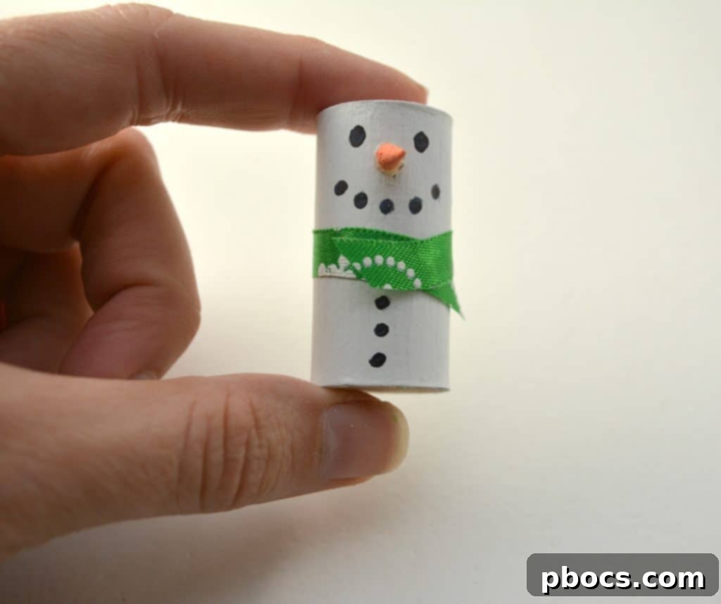 DIY Wine Cork Snowman: Crafting the Scarf Adding a ribbon scarf to the wine cork snowman