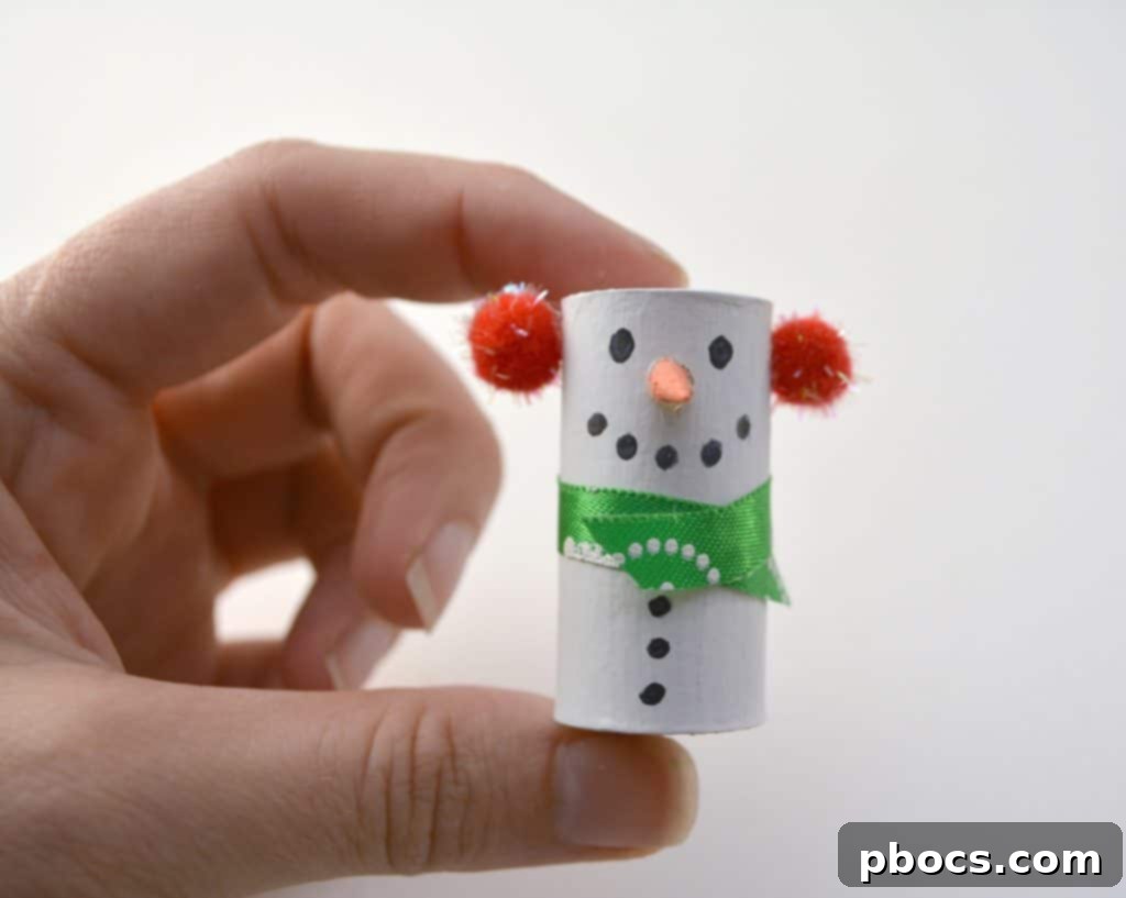 Adding Buttons to Your Wine Cork Snowman Drawing black buttons on wine cork snowman with Sharpie