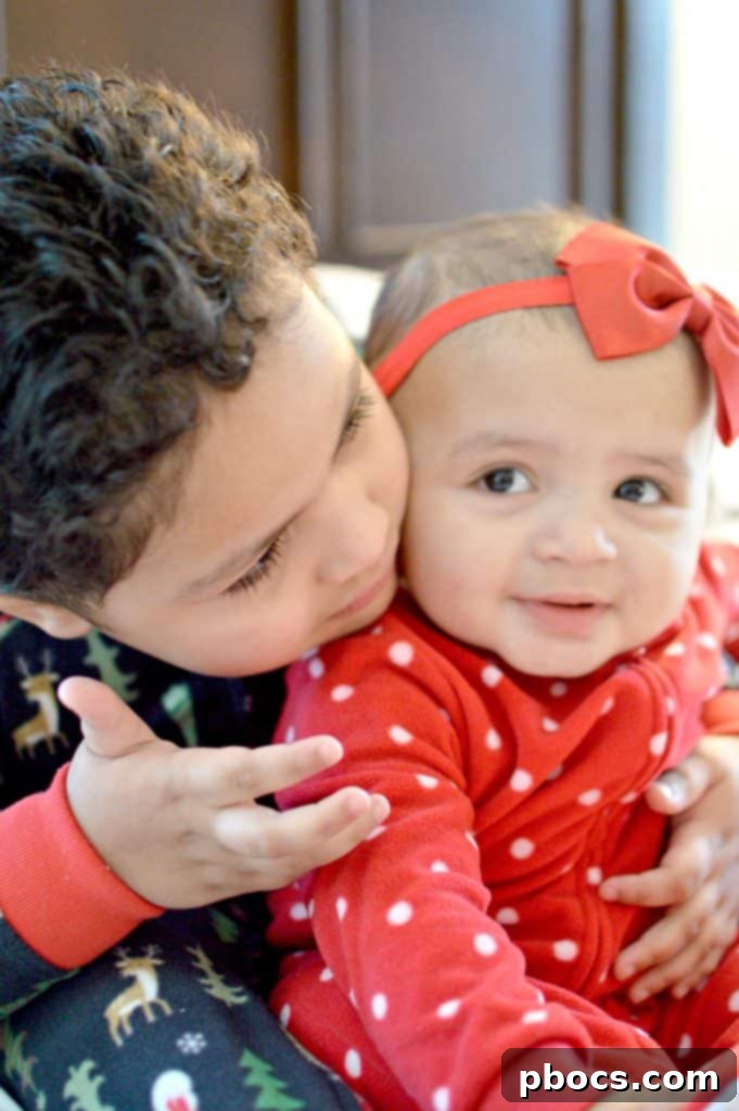 Our Favorite Holiday Pajamas - Two girls cuddling in matching festive pajamas