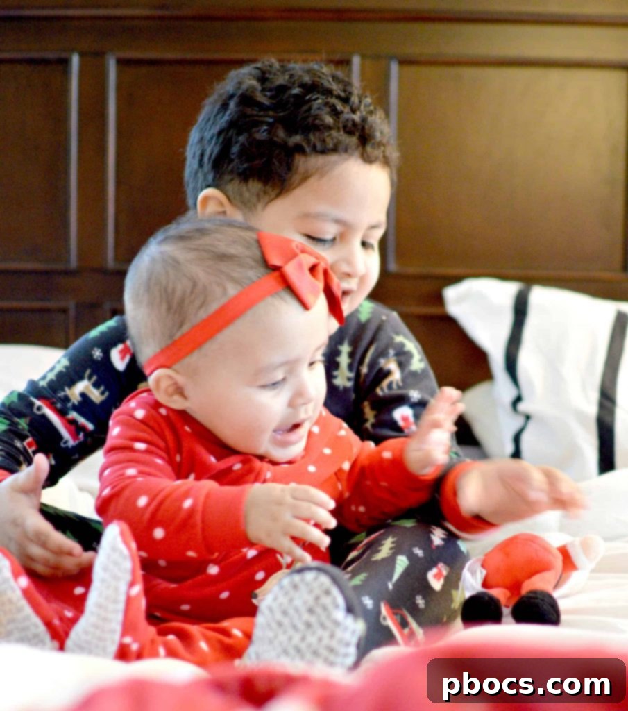Our Favorite Holiday Pajamas - Girl playing with a festive ornament