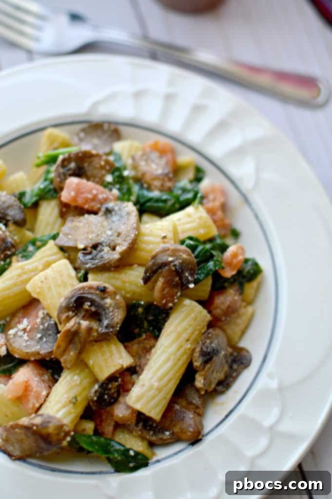 Serving suggestion for Cajun mushroom & spinach rigatoni with garlic bread