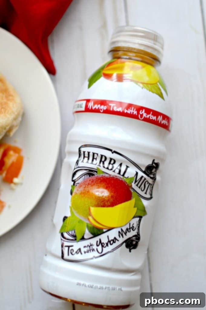 Three Herbal Mist tea bottles displayed next to a fresh quinoa burger