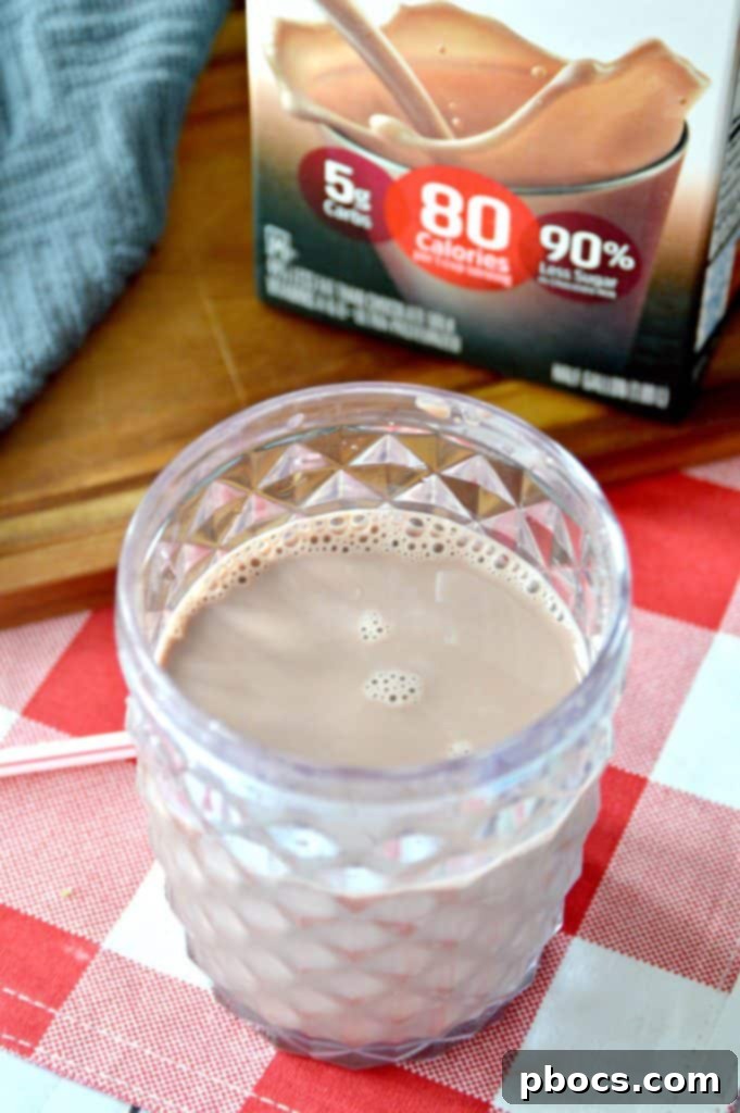 Block by Block: Masterful Calorie Management 4 Hood Calorie Countdown cartons displayed neatly in a grocery store refrigerator, showcasing the diverse range of varieties.