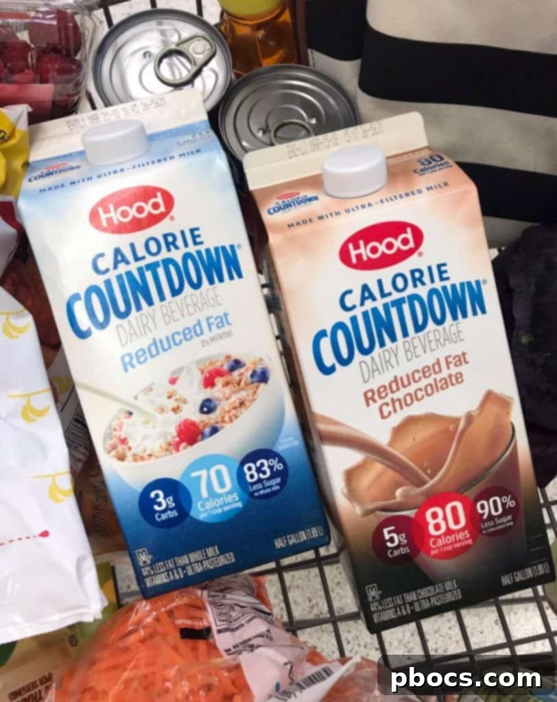 Block by Block: Masterful Calorie Management 5 A person happily holding a glass of Hood Calorie Countdown milk, radiating satisfaction and wellness.