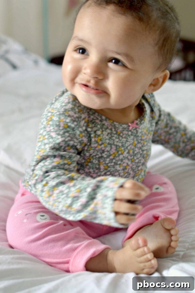 Olivia tenderly hugging her baby sister Lauren, both dressed in charming Carter's outfits, radiating pure sisterly love.
