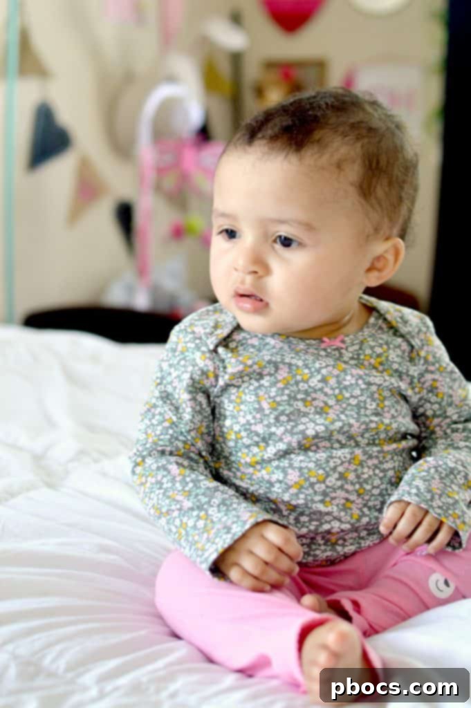 Lauren, dressed in an adorable Carter's Easter character set, perhaps with a sweet bunny design, looking ready for spring festivities.