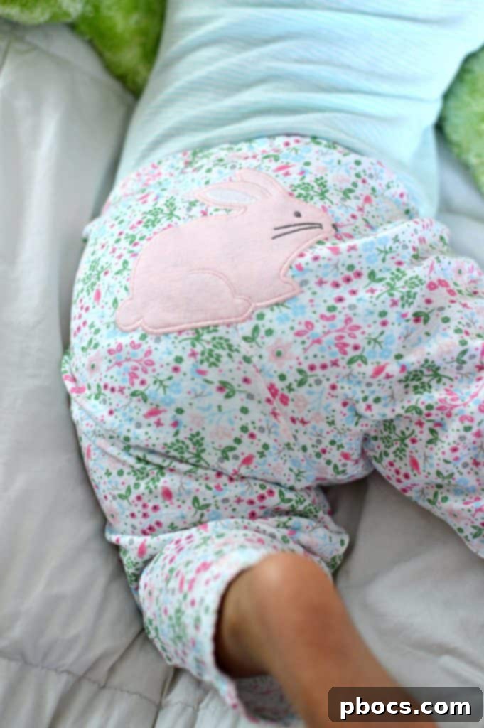 Olivia and Lauren sharing a joyful moment of play, highlighting their sisterly bond and the practical comfort of their Carter's attire.