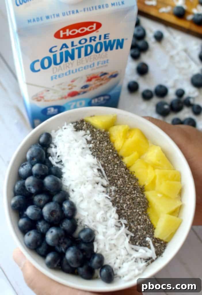 Tropical Dream Banana Pineapple Bowl 6 A freshly blended Banana Pineapple Smoothie Bowl mixture poured into a bowl, ready for toppings