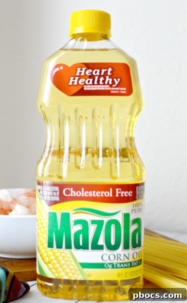 Close-up shot of a pot filled with creamy Skinny Cajun Shrimp Fettuccine Alfredo sauce, before adding pasta and shrimp.