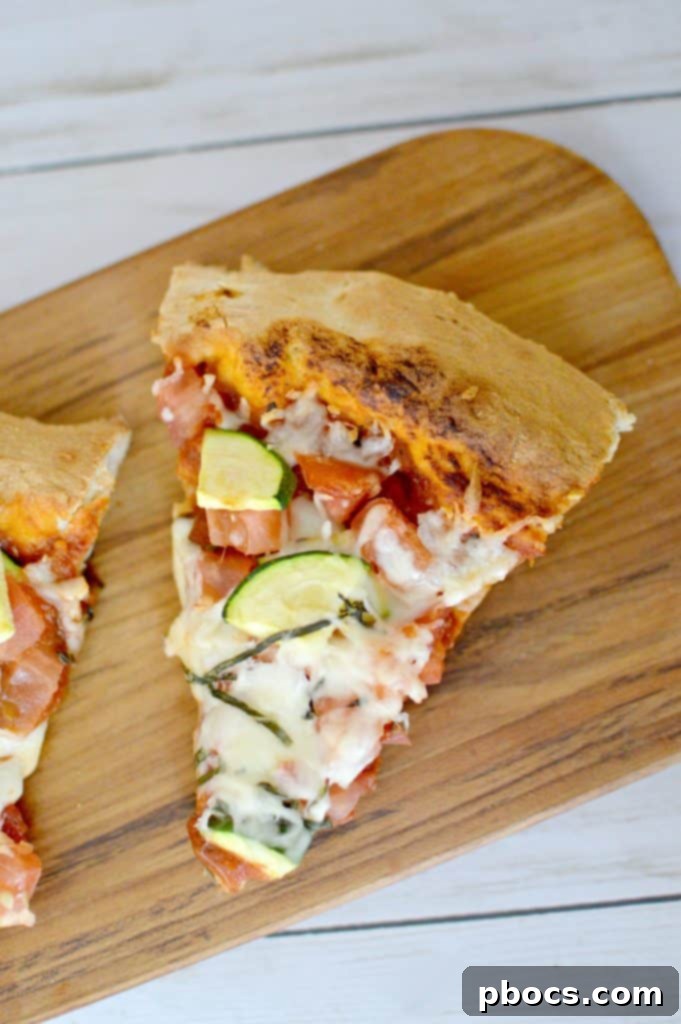 Close-up of Fresh From Florida Tomato & Zucchini Family Pizza, highlighting fresh toppings