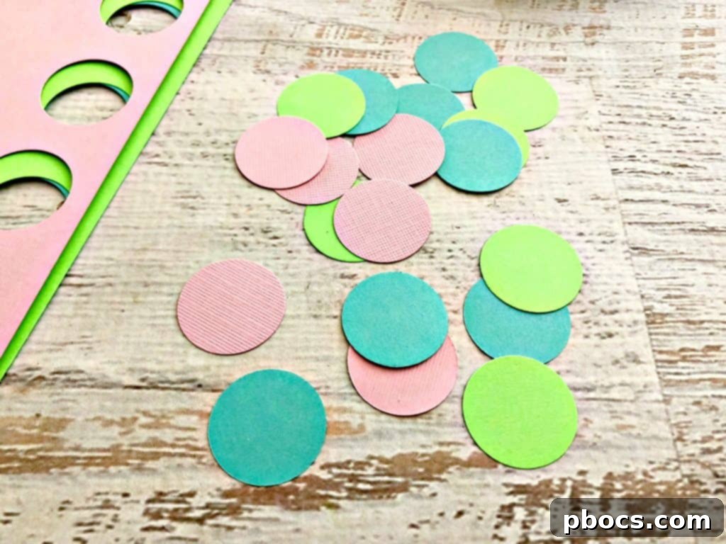 Simple DIY Mermaid Tail 6 Punching colorful cardstock circles for mermaid scales