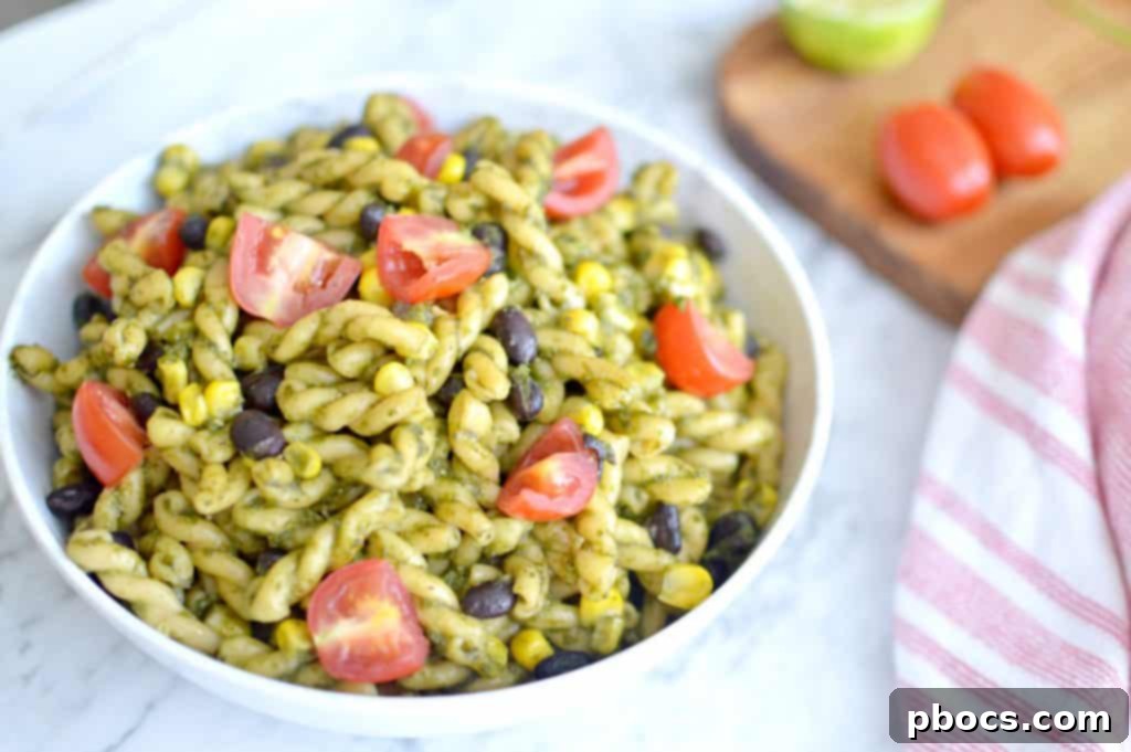 Fresh Jalapeño Pesto Pasta Salad with cherry tomatoes and corn