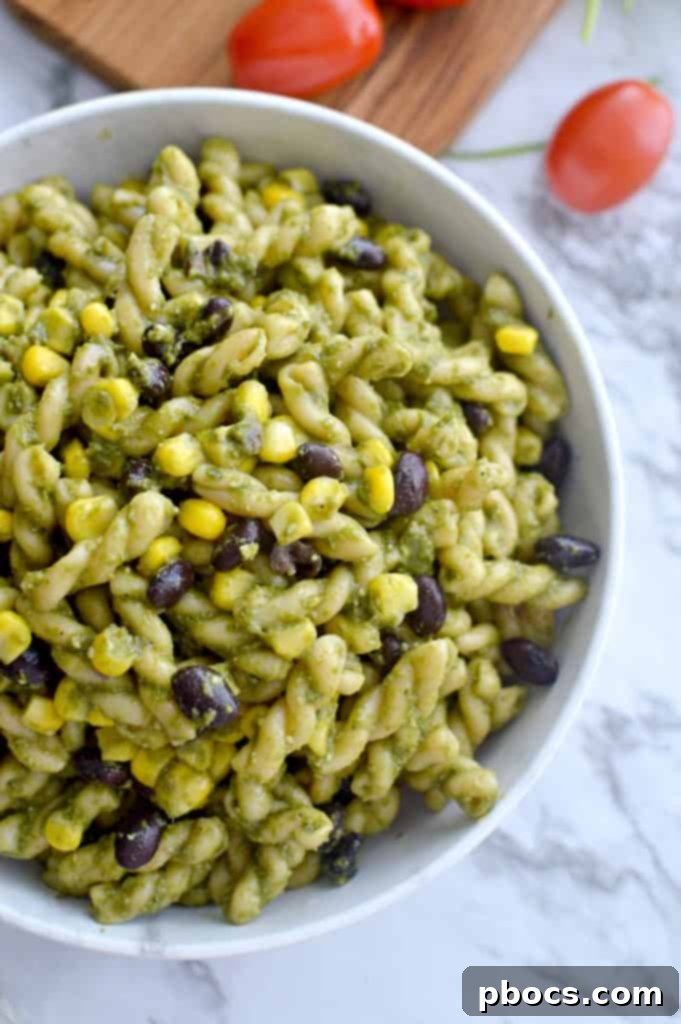 Cooked Gemelli pasta mixed with corn and black beans