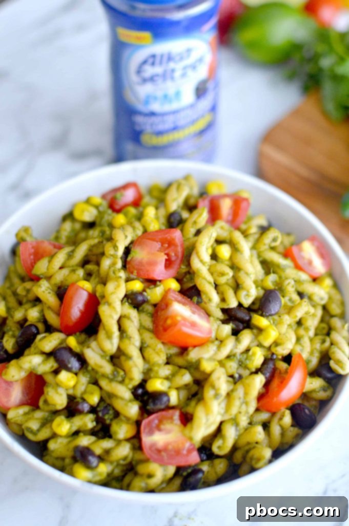 Serving a bowl of homemade Jalapeño Pesto Pasta Salad