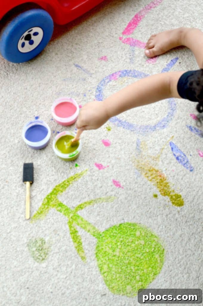 Child excitedly playing with Easy DIY Sidewalk Chalk Paint