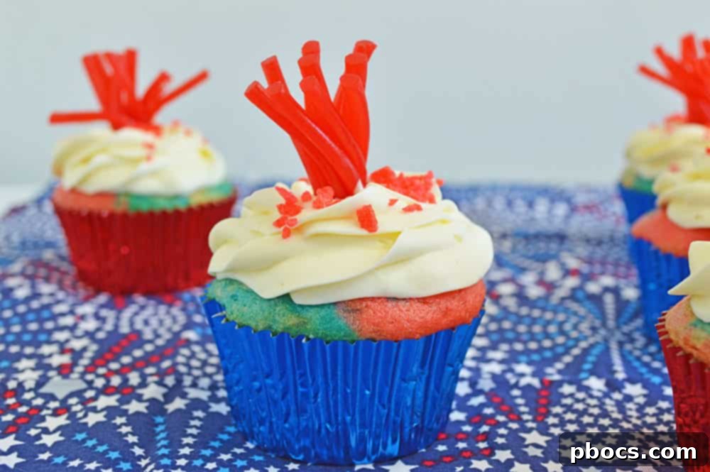 Sparkling Fireworks Cupcakes Recipe 2 Close-up shot of a single Fireworks Cupcake, highlighting the frayed Twizzler and Pop Rocks.