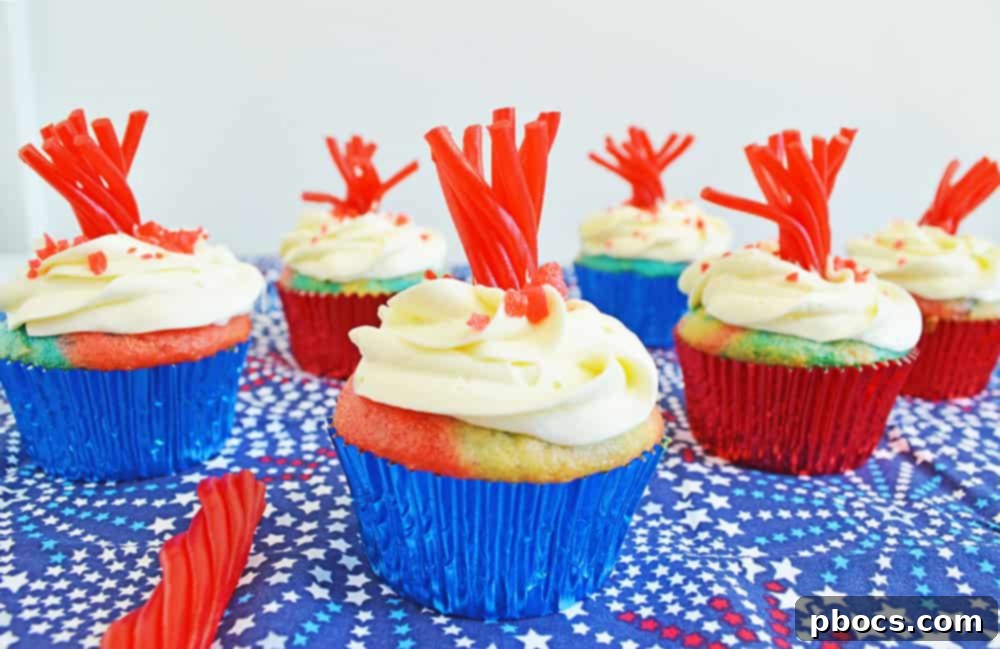 Fireworks Cupcakes Recipe Fireworks Cupcakes Recipe - A tray of unbaked cupcake batter showing the red, white, and blue layers.