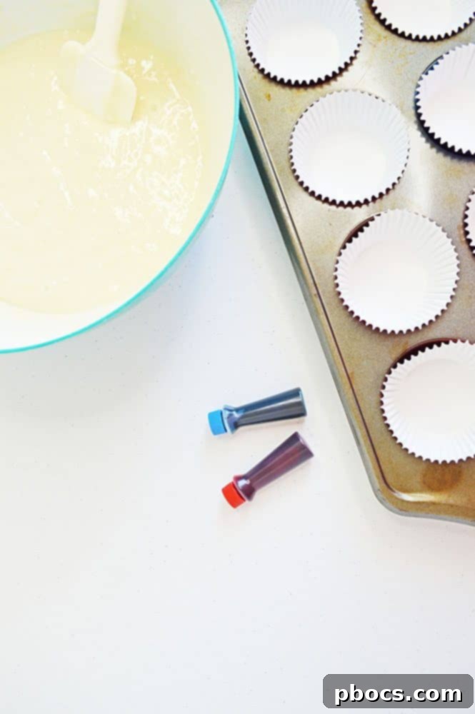 Fireworks Cupcakes Recipe Mixing cupcake batter in a bowl for Fireworks Cupcakes recipe.