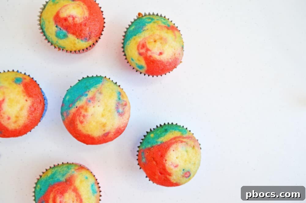 Fireworks Cupcakes Recipe Mixing ingredients for cream cheese frosting in a large bowl.